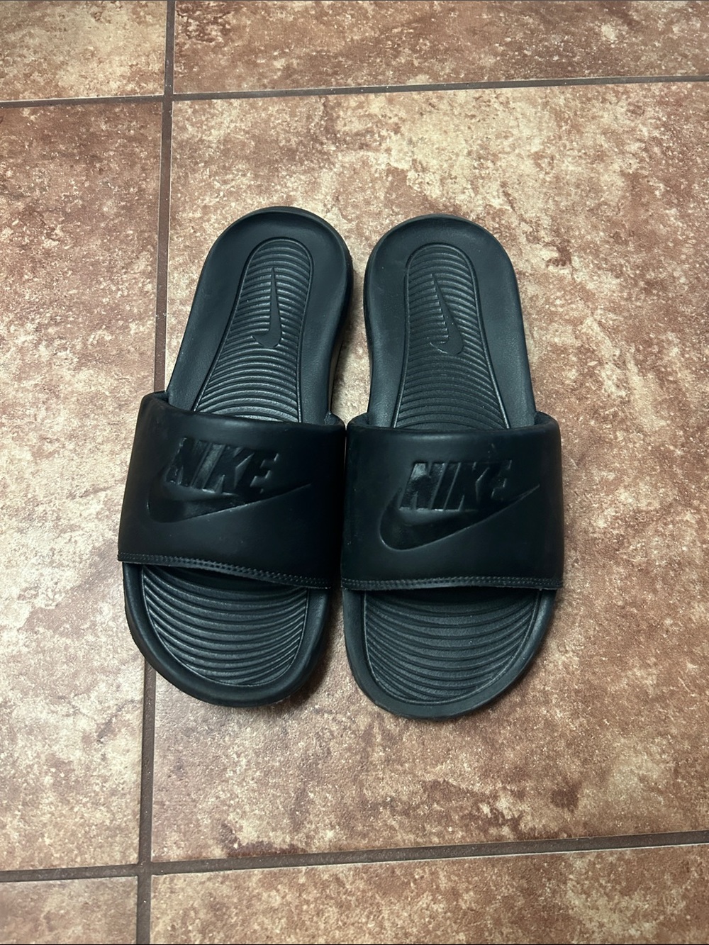 Nike Black Slide Sandals with Embossed Swoosh